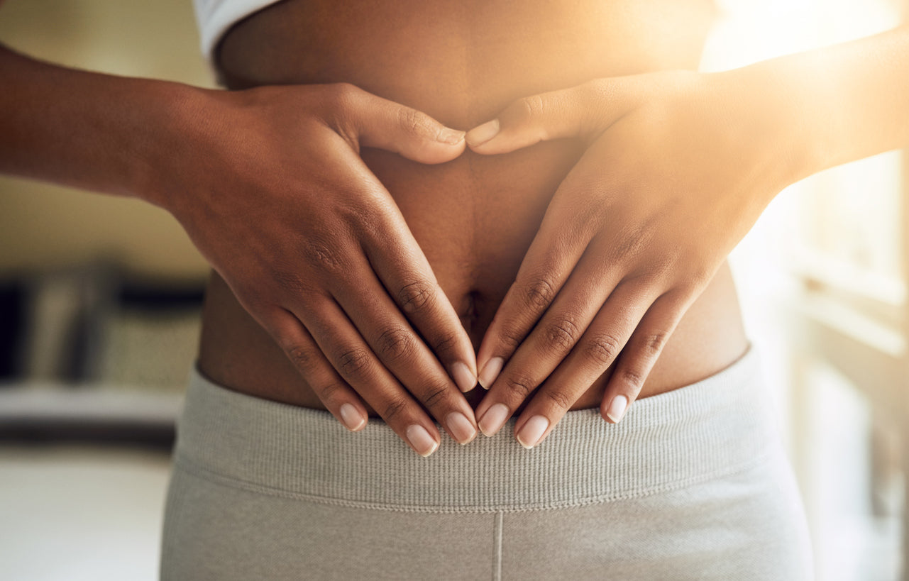 Woman holding stomach